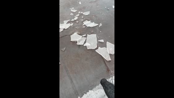 Breaking ice with a blower in Detroit, Michigan, USA