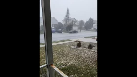 Large hailstones blanket suburban neighborhood during severe storm in Utah, USA