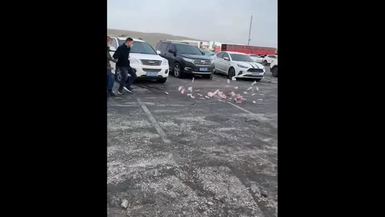 Money blown away by wind in Hunan, China