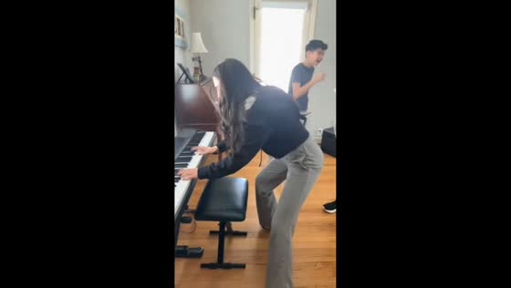 Woman plays original song on piano after dentist visit in New York, USA