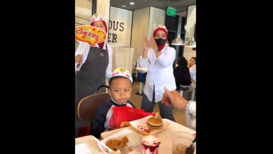 Child uninterested during birthday song at McDonald's, Kota Bandung