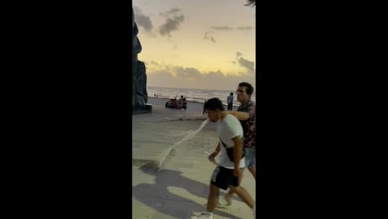 Man suddenly vomits while walking in Playa del Carmen, Mexico