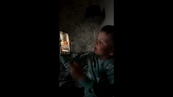 Boy gives slimming tips while watching workout video in Llandudno, Wales