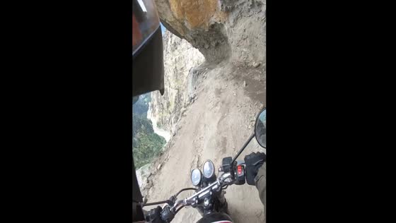 Motorcycle ride on cliff edge in Jammu, Kashmir