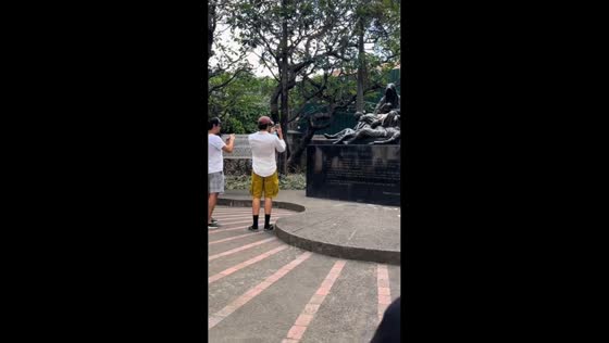 Foreign tourists take photos of sleeping cat in Intramuros, Manila, Philippines