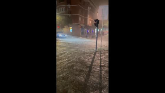Torrential rain floods streets during severe storm in Cornellà de Llobregat, Spain
