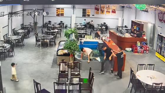 Two men fall into indoor pond during mishap in Guangdong, China
