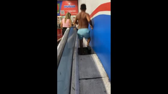 Man falls through platform while catching snake beside escalator in São Luís, Brazil