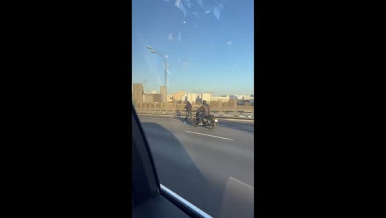 Electric scooter rider shocks traffic with high-speed ride in Moscow, Russia