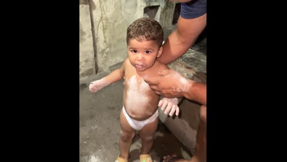 Toddler eats coal ash in Choró, Ceará, Brazil