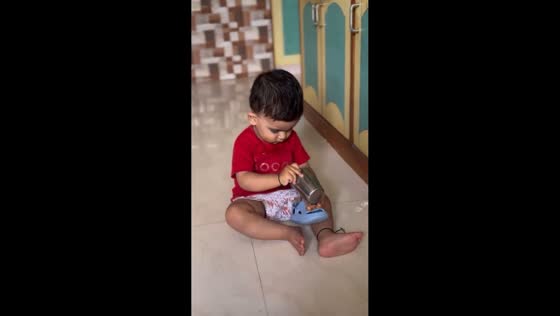 Toddler pours water into sandal and then drinks it in Surat, India