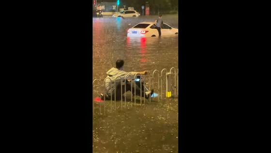 Vehicles become stranded in deep floodwater across Taiyuan street in Shanxi, China