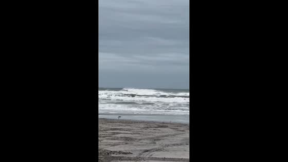 Rising tide and rough surf batter Wildwood shoreline during nor’easter in New Jersey, USA