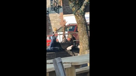 Man on bench unintentionally reacts to math question in Plymouth, United Kingdom