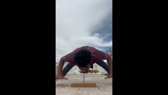 Balancing on knife edge supported by nail edge in Tamil Nadu, India