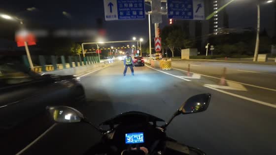 Traffic officer stops rider near elevated highway in Hubei, China