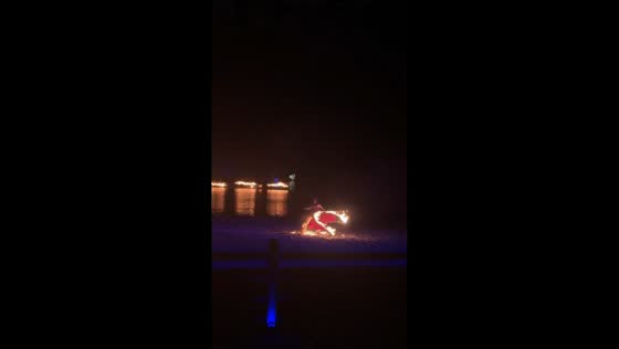 Performer runs to water after fire catches dress during act in Jiangsu, China