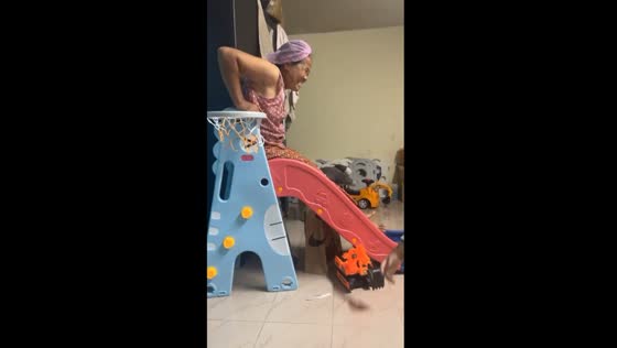 Grandmother's slide mishap while playing with grandson