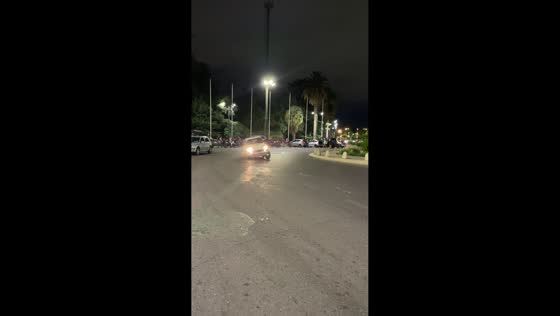 Old car makes sharp tilted turn in Mendoza, Argentina