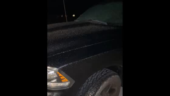 Car covered in ice in Northern Indiana due to freezing rain
