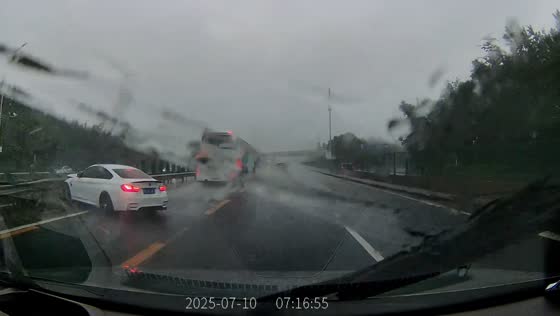 Car loses control on slippery road during rain in Beijing, China