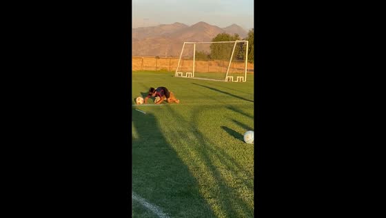 Boy trips over dog while playing football in Quilicura, Santiago, Chile