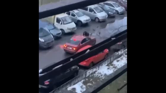 An ex-boyfriend clings to car hood after breaking up.