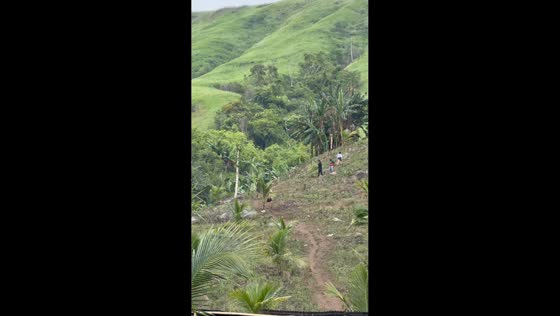 One-legged man descends mountain trail using crutches in Sultan Kudarat, Philippines