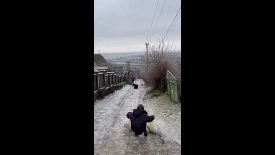Girl loses footing on icy walkway in Moldova