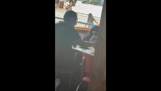 Man having an unexpected conversation in Santa Monica, California, USA