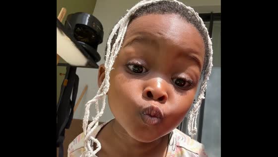 Toddler calls herself pretty and a princess while playing with a mop string