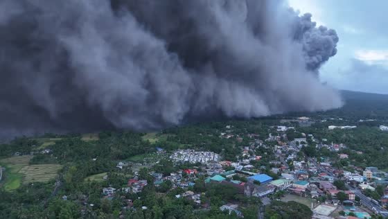 Drone footage captures Mayon Volcano ash plume spreading in Camalig, Albay, Philippines