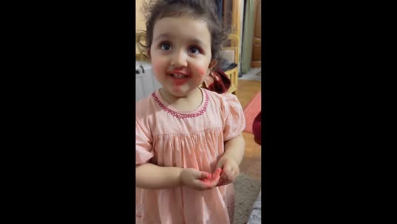 Little girl makes a mess with lipstick in Abbottabad, Pakistan