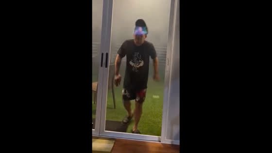 Man walks into closed glass door during karaoke party in Manado, Indonesia