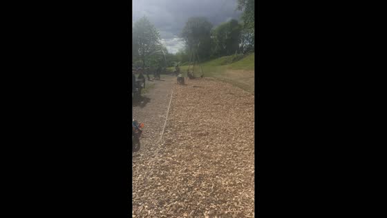 Man trips while pushing child on zipline at park in Salford, England