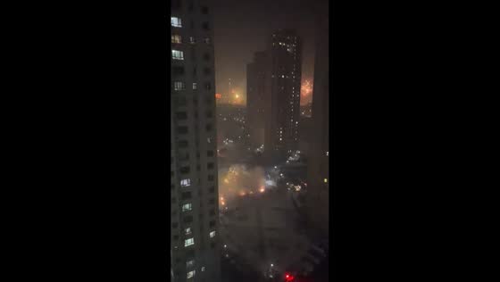 Vibrant Chinese New Year fireworks fill the sky over Urumqi, Xinjiang, China