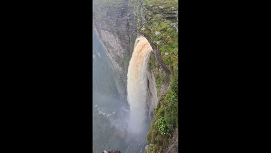 Cliffside view captures powerful waterfall in Palmeiras, Bahia, Brazil