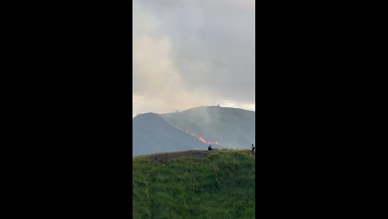 Grass fire spreads across hillside at Alicia Panoramic Park in Alicia, Bohol, Philippines