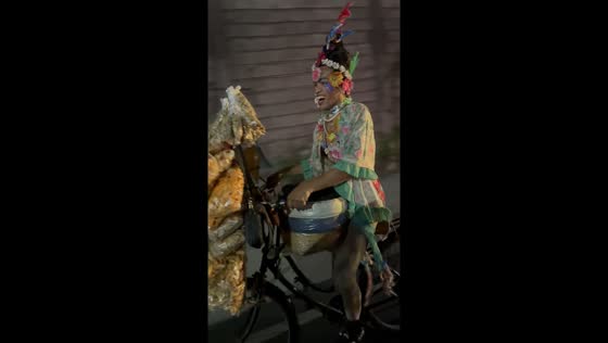 Bulacan's balut vendor pedals joyfully in extravagant attire