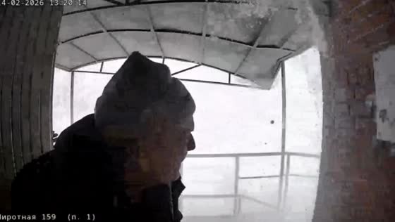 Large snow slide narrowly misses pedestrians in Tyumen, Russia