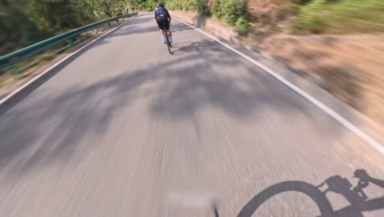 Cyclist misses a mountain road turn and falls into a canal in Zhejiang, China