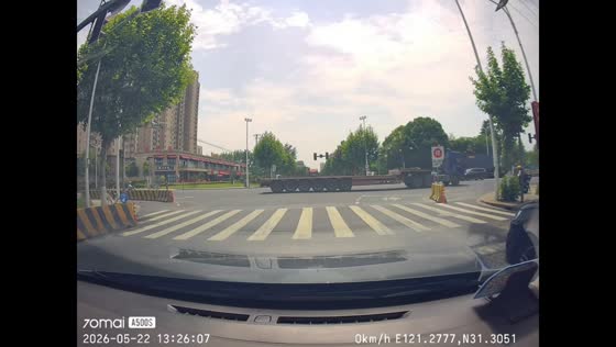 Loose truck tires roll into car at intersection in Jiangsu, China
