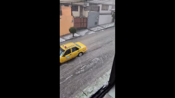 Heavy hailstorm blankets residential streets and causes flooding in Quito, Ecuador
