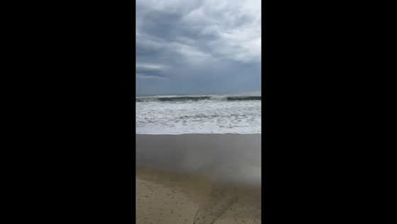 Huge waves and stormy skies at An Bang Beach in Hội An, Vietnam