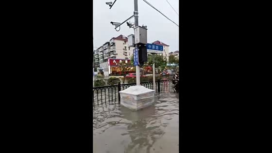 Heavy rainfall overwhelms roads in Shanghai, China