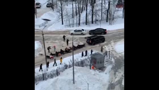 Thrilling snow tubing extravaganza: car-pulled joyride delights crowds