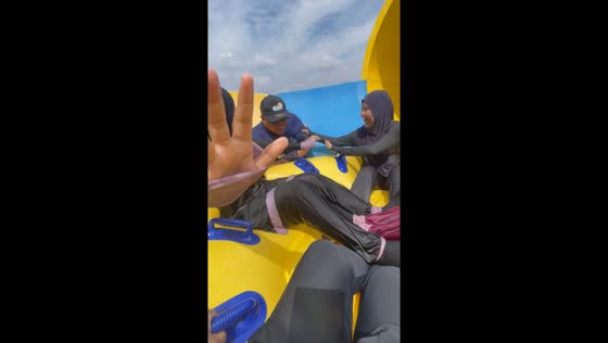 Lifeguard joins riders on slippery water slide: unplanned adventure ensues
