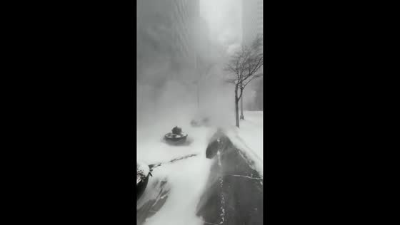 Strong winds whip snow and reduce visibility during winter storm in New York, USA