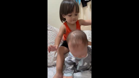 Sibling's play turns pushy: 2-year-old's reaction to baby's tears caught on video