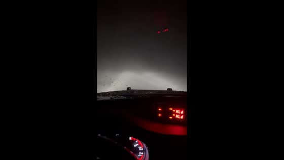 Near-zero visibility driving during blizzard north of Granada, Minnesota, USA
